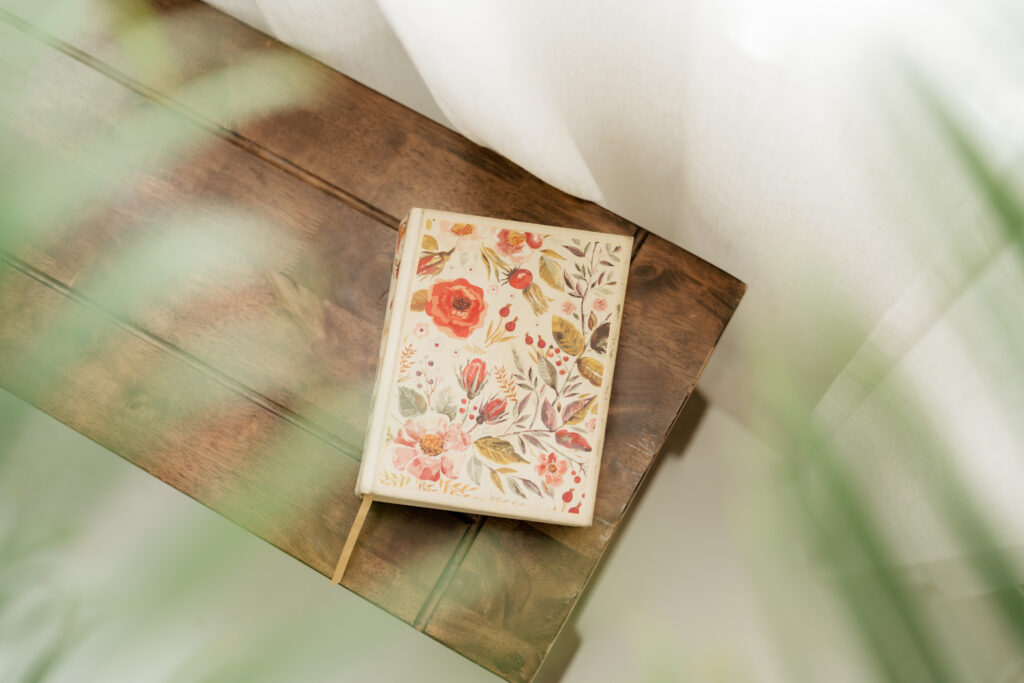 Floral cover Bible sitting on bench